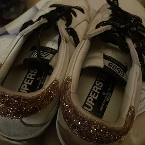 A pre owned shoes,still in.Pristine condition.